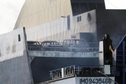 Burnt-out cars are seen on a deck of the Norman Atlantic multi-deck car-and-truck ferry docked at Brindisi harbour, after a fire broke out on it off the coast of Greece, January 2, 2015. Tug boats hauled the burnt-out hulk of the ferry into the southern Italian port on Friday, opening the way for an investigation into the cause of the blaze that killed at least 11 people. The ferry caught fire off Greece's Adriatic Coast on December 28, 2014 whilst on a voyage to Italy. REUTERS/Ciro De Luca (ITALY - Tags: DISASTER MARITIME) - RTR4JWQD